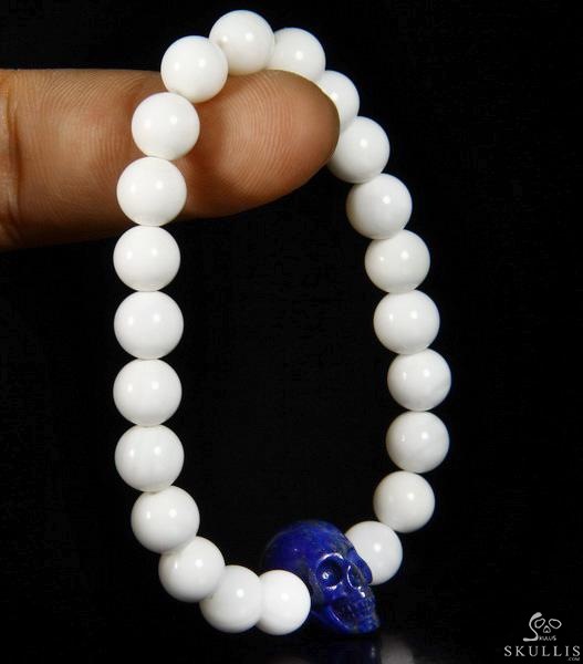 The Harmonious Pulse - Tridacna Gigas Beads Stretch Bracelet with Hand-Carved Lapis Lazuli Skull, Crystal Healing Skull Jewelry, for Women & Men The Harmonious Pulse - Tridacna Gigas Beads Stretch Bracelet with Hand-Carved Lapis Lazuli Skull, Crystal Healing Skull Jewelry, for Women & Men
