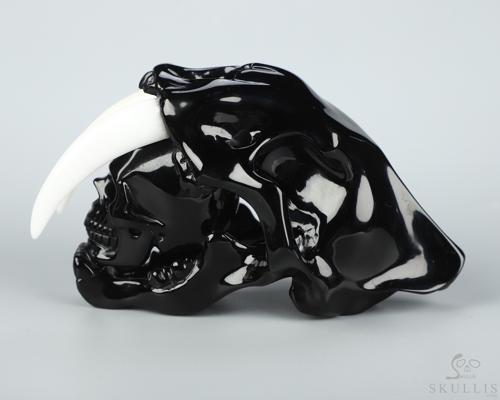 5.1" Black Obsidian Hand Carved Crystal Smilodon SABER-TOOTHED Tiger/Cat Skull and White Jade Tooth Sculpture 5.1" Black Obsidian Hand Carved Crystal Smilodon SABER-TOOTHED Tiger/Cat Skull and White Jade Tooth Sculpture
