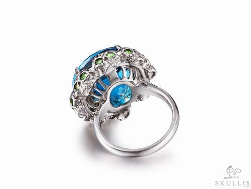 Circle of Fate - Blue Topaz with Sapphire and Tsavorite in 925 Sterling Silver Skulls Ring, Crystal Healing Skull Jewelry, for Women & Men Circle of Fate - Blue Topaz with Sapphire and Tsavorite in 925 Sterling Silver Skulls Ring, Crystal Healing Skull Jewelry, for Women & Men