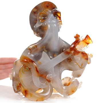 June 1, 2026 ACSAD (A Crystal Skull a Day) - Ocean Octave - Carved Carnelian Octopus Skull Guitar Sculpture